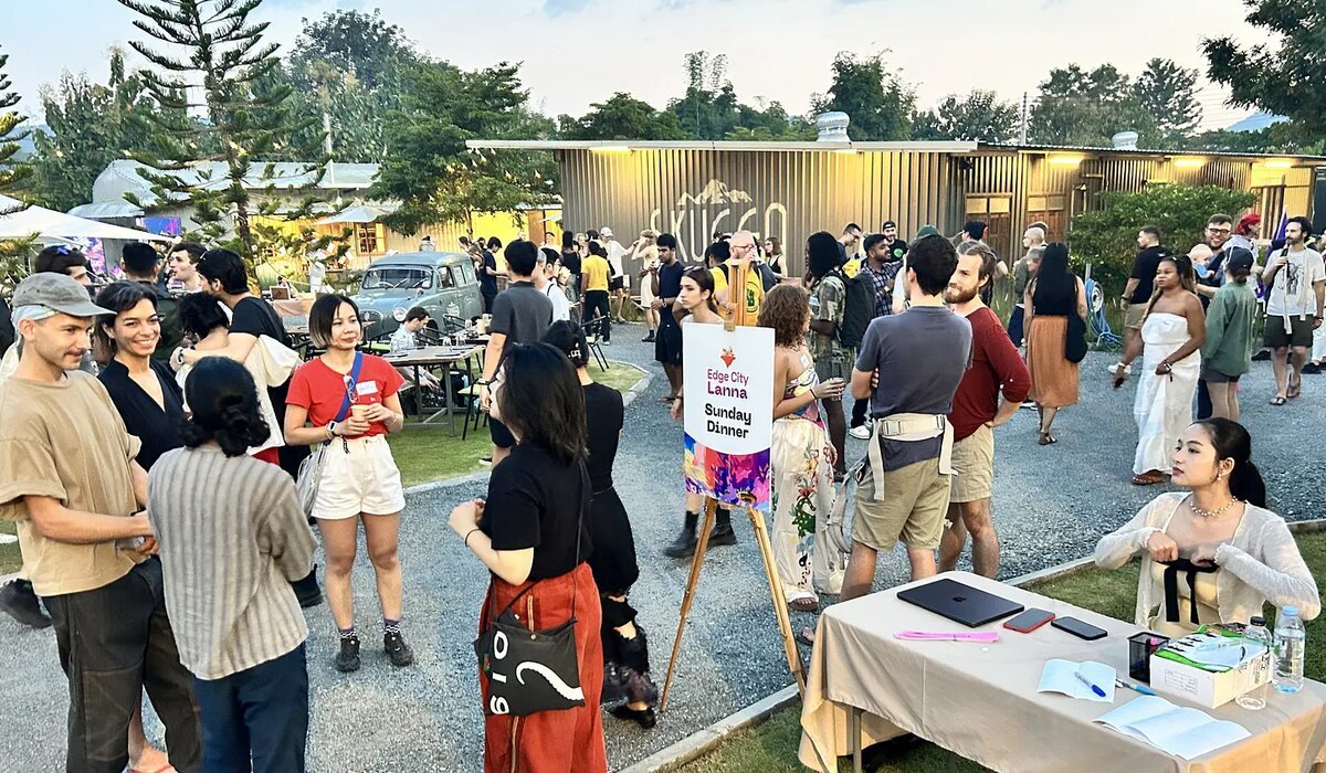 Community gathering at a pop-up village event in Chiang Mai